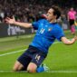 TOPSHOT - Italy's midfielder Federico Chiesa celebrates after scoring the opening goal during the UEFA EURO 2020 semi-final football match between Italy and Spain at Wembley Stadium in London on July 6, 2021. (Photo by Frank Augstein / POOL / AFP)